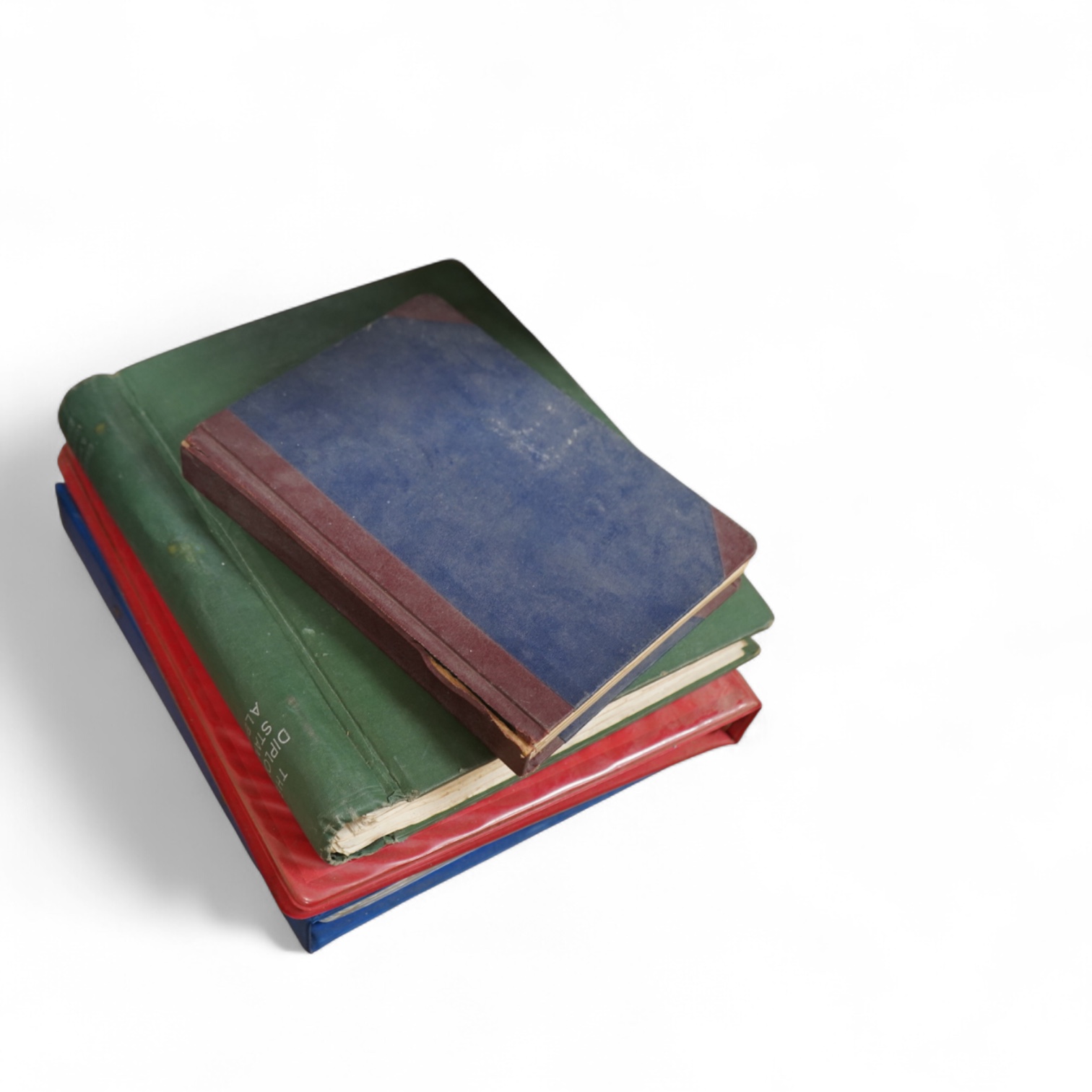 Four stamp albums including a first day cover album